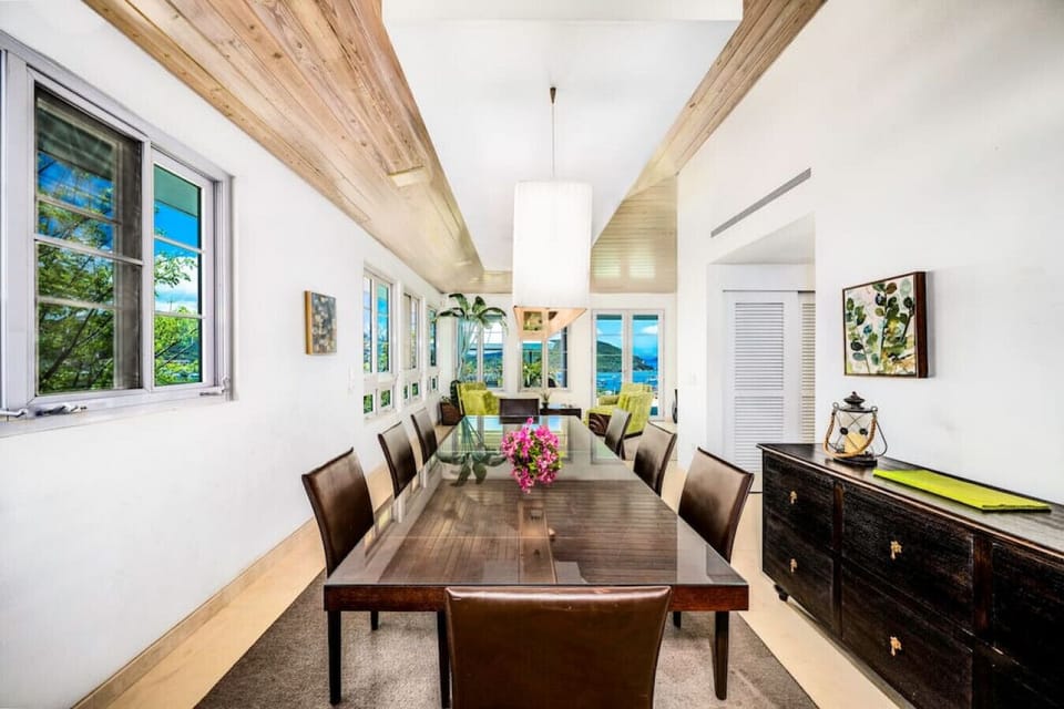 The elegant dining area with the sitting area in the background.