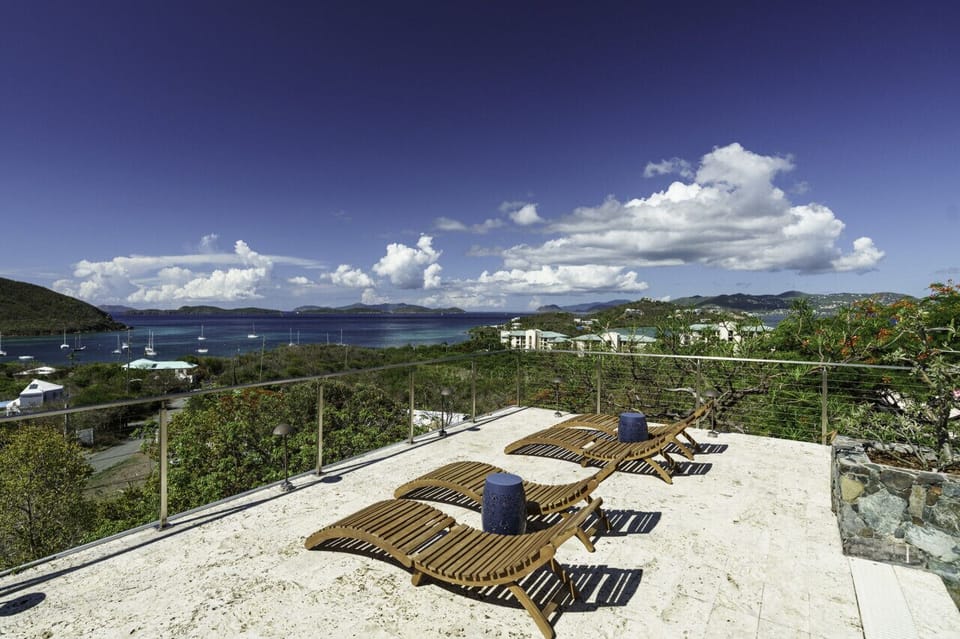 The spacious pool deck with incredible views, wifi, sun loungers, and 2 covered sitting areas.