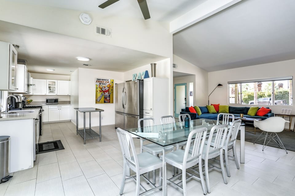 Open kitchen and dining space with stainless appliances