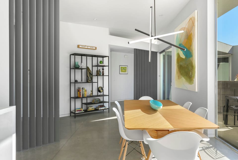 Stylish dining space with contemporary art and natural light
