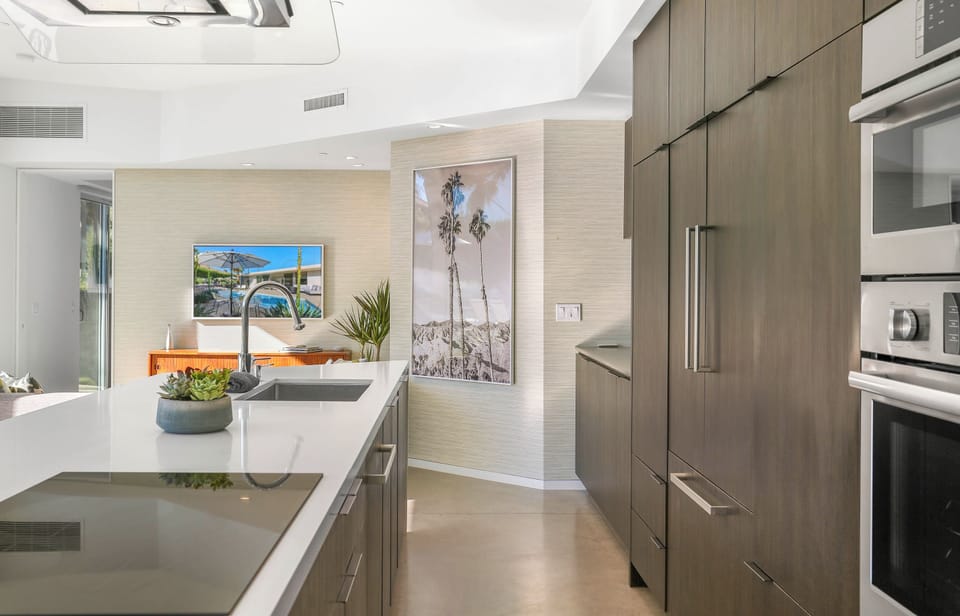 Chef's kitchen with premium appliances and sleek modern finishes