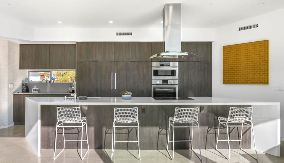 Gourmet kitchen with waterfall island and bar seating
