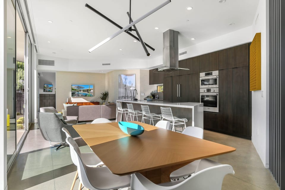 Designer dining area with modern lighting and open floor plan