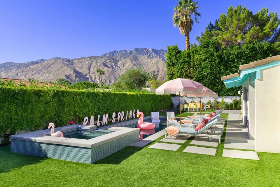 Private pool with mountain views, loungers, and iconic Palm Springs style