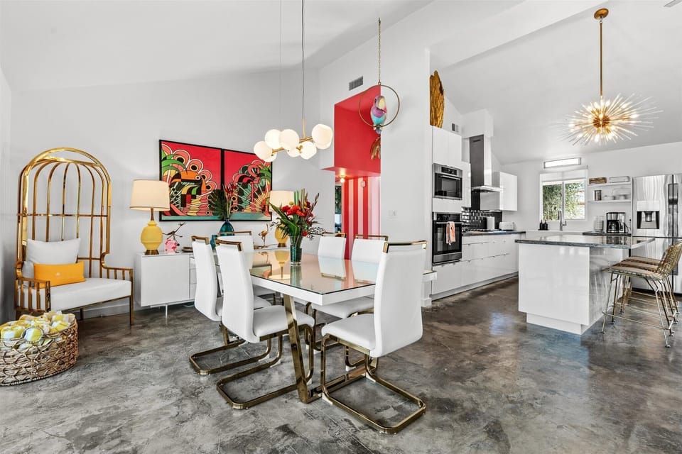 Dining area with designer lighting and seamless flow to kitchen