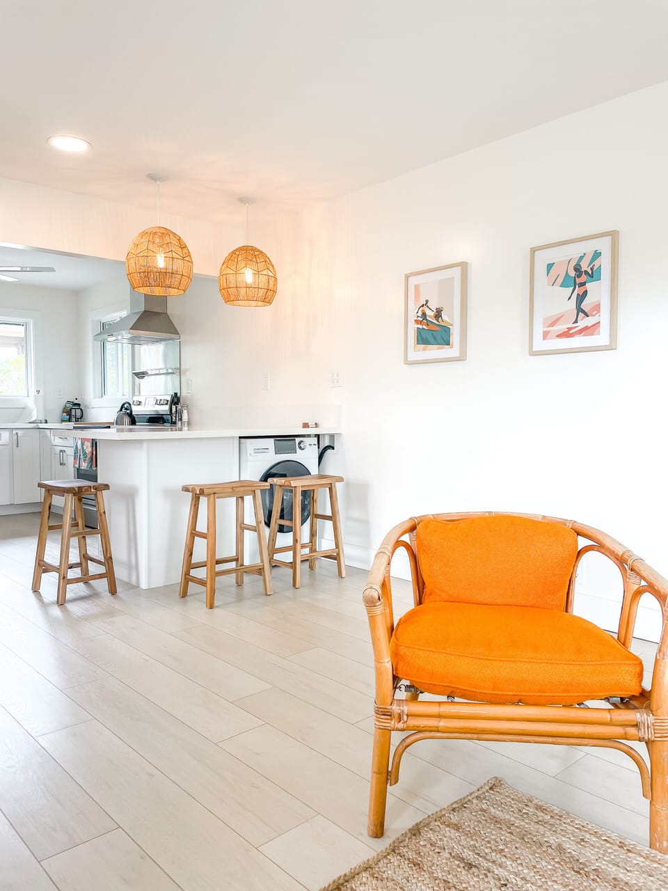 Living room opens up into the kitchen with bar and washer dryer