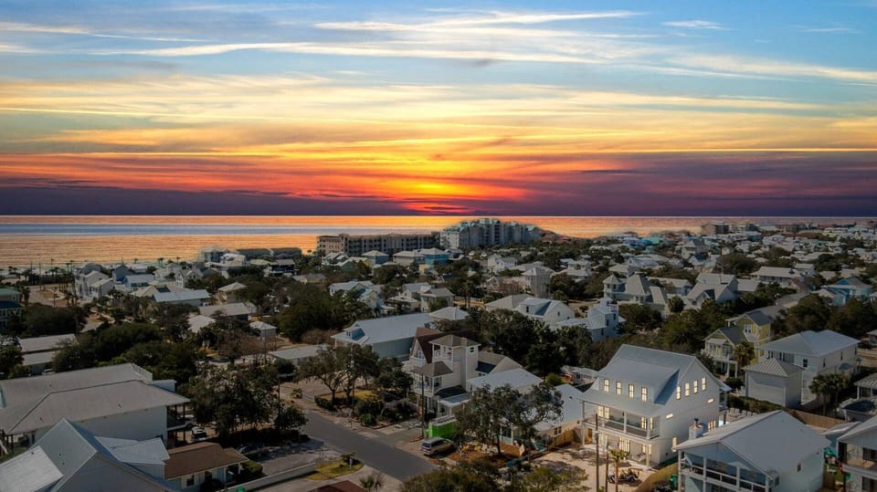 Sunset aerial w/ warm colors stretching across the horizon.