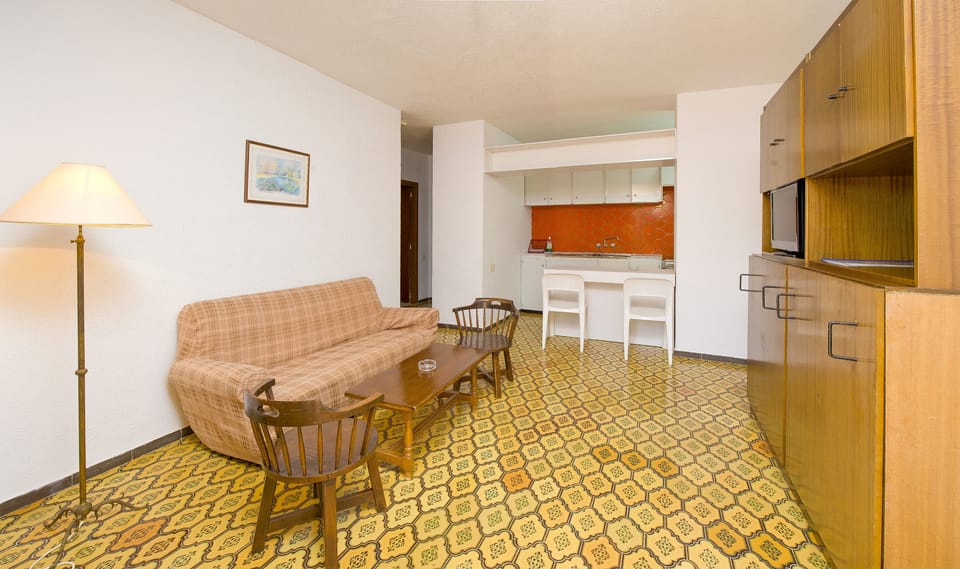 Apartment, 1 Bedroom | Living room | Flat-screen TV
