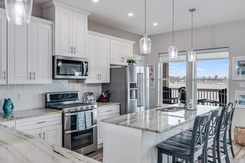 Kitchen with additional seating for 8 at 2 kitchen bar areas and views of Little Bay.  Large fully equipped kitchen.
