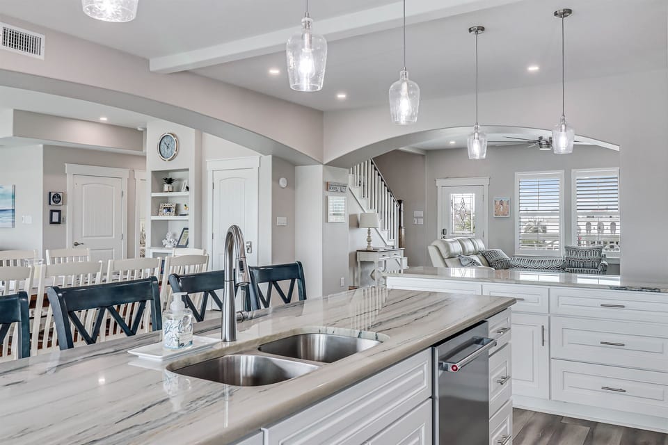Open Concept downstairs with 2 living areas, dining area and fully equipped kitchen with pantry