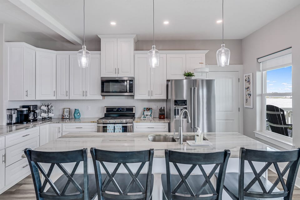 Kitchen Island Seating for 4.  French door refrigerator with water and ice dispenser and bottom freezer.
