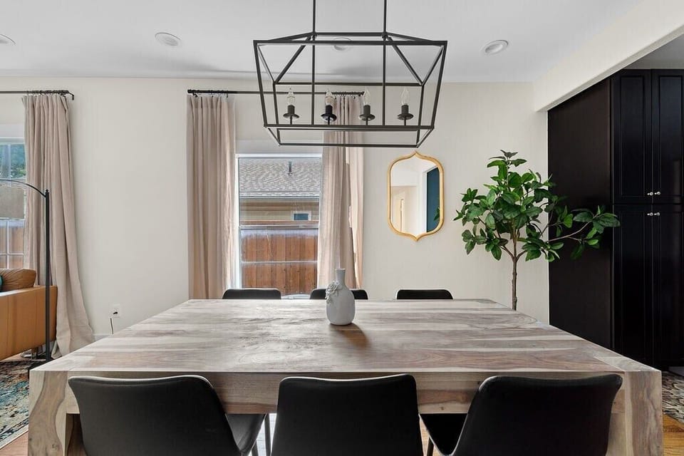 This large dining table comfortably seats six--perfect for meals or games.
