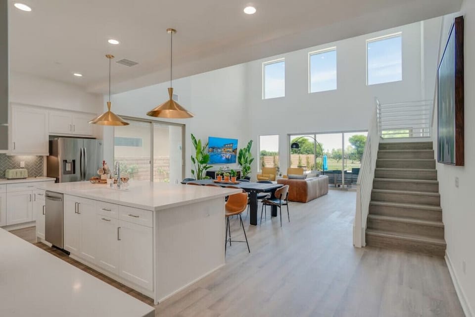 Expansive kitchen & living space w/ high ceilings & seamless flow for gathering