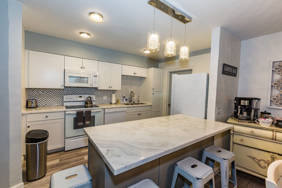 Renovated Kitchen open to the dining and living areas full of cooking amenities 