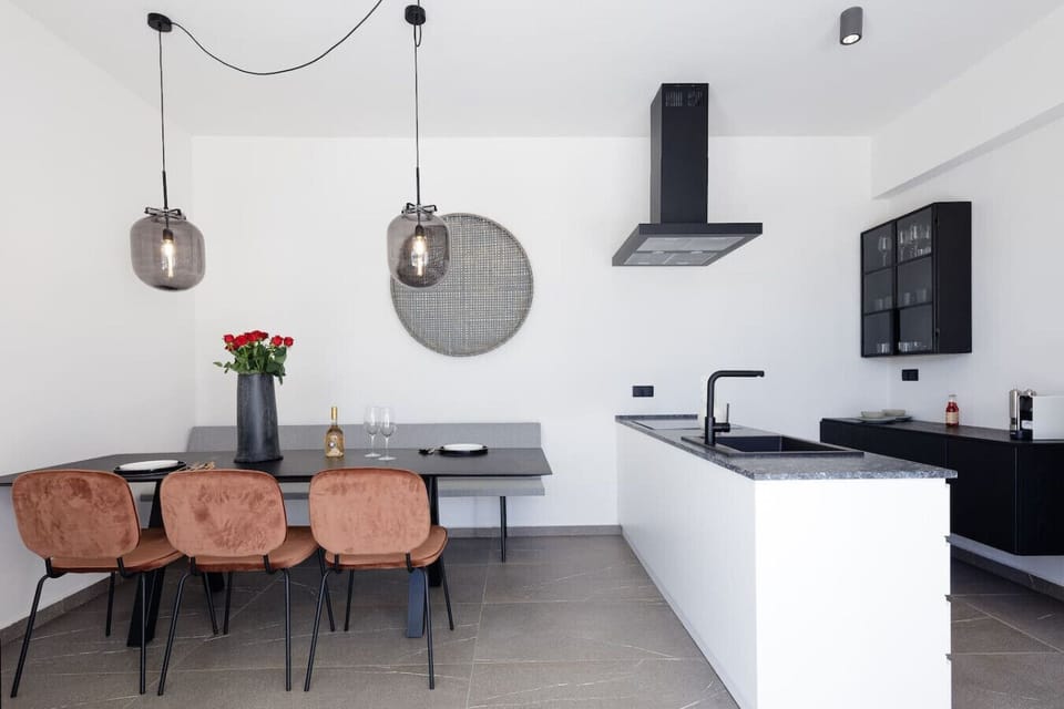 Open-plan kitchen with stylish dining area.
