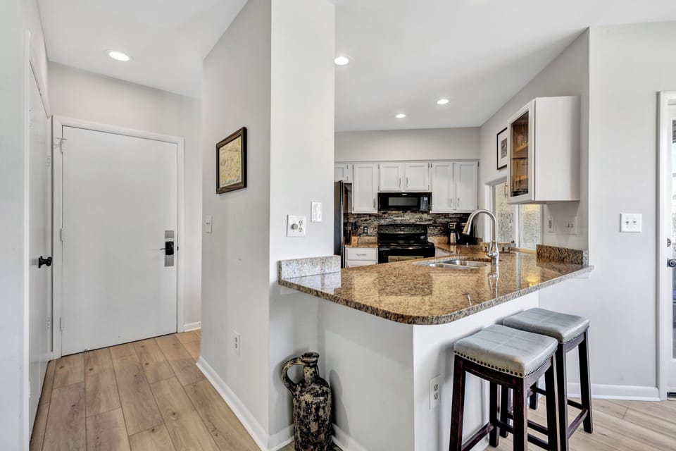 Sleek & Clean Entryway Flowing into Our Gorgeous Kitchen