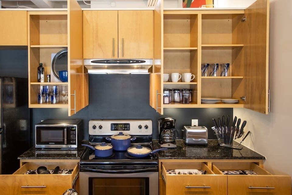 Enjoy the modern kitchen with ample counter space and all the essentials needed to prepare a meal, providing the perfect blend of comfort and convenience in downtown Fort Worth.