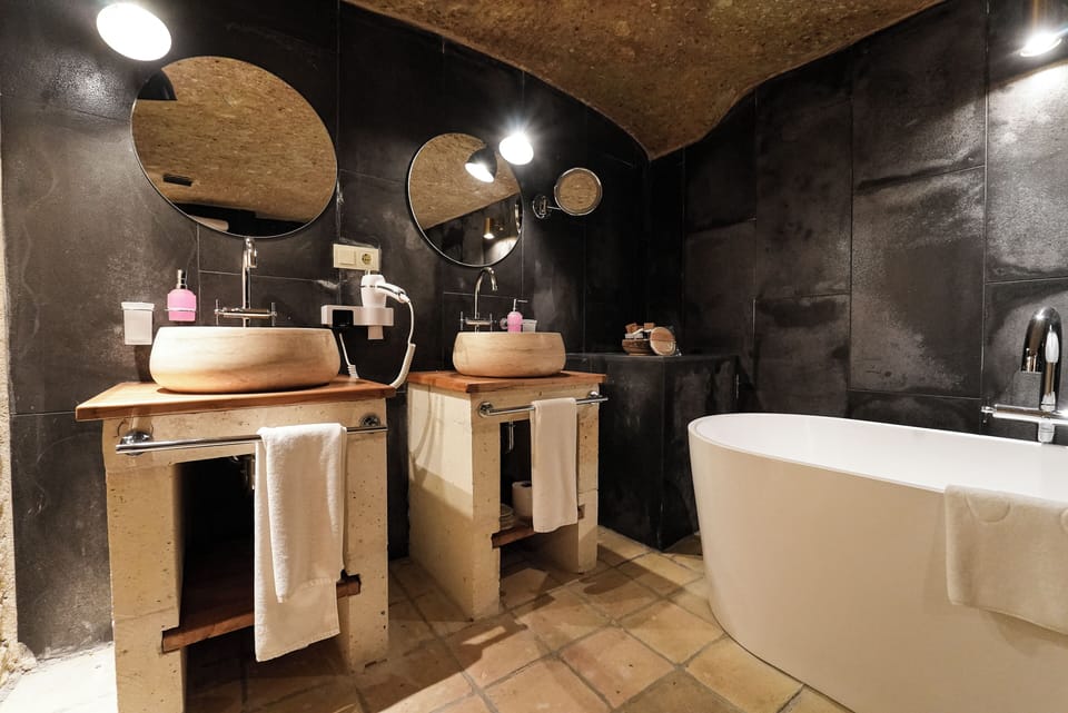 Mansion Cave Room | Bathroom | Separate tub and shower, rainfall showerhead, designer toiletries