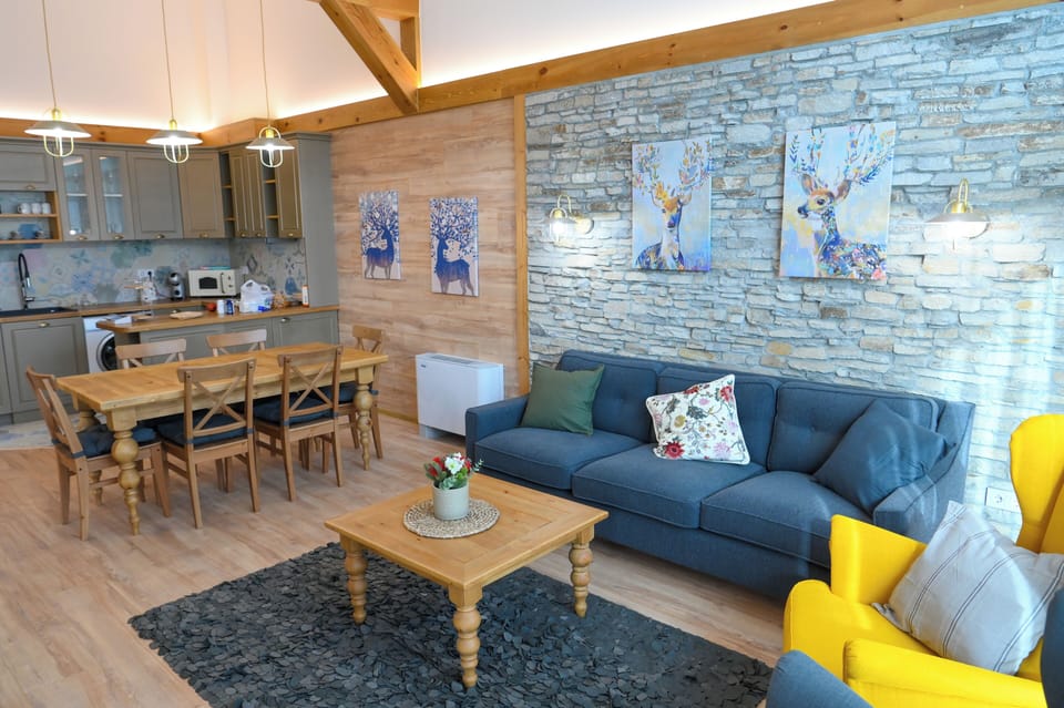 Deluxe Chalet, 3 Bedrooms, Sauna, Mountain View | Living area | 100-cm TV with satellite channels, fireplace