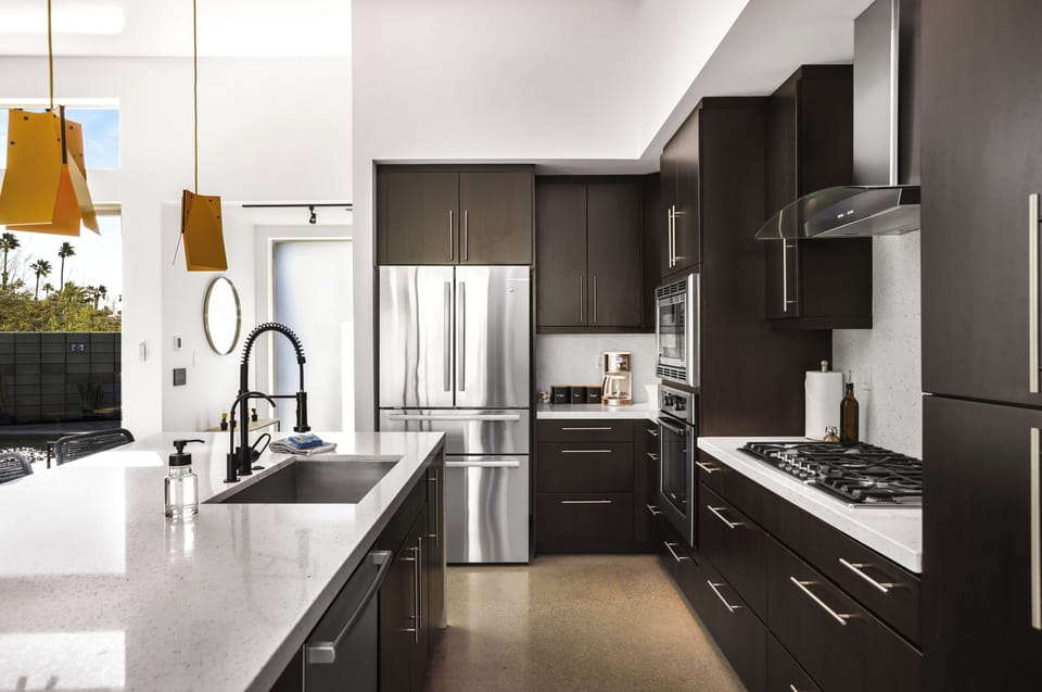 Sleek kitchen with gas cooktop, double ovens and generous prep space