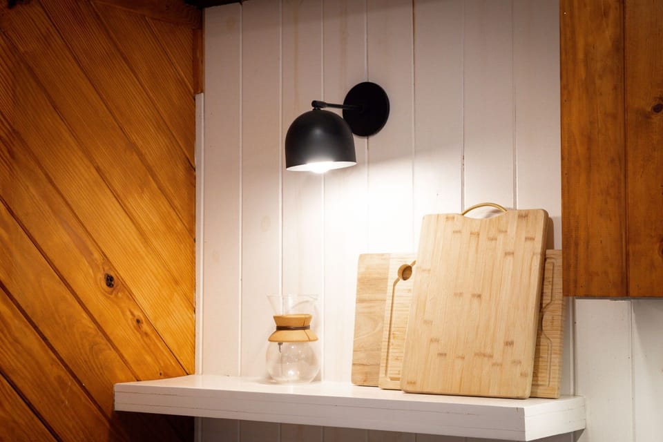 It’s the little things—warm lighting and wood textures give this cabin its signature cozy feel.
