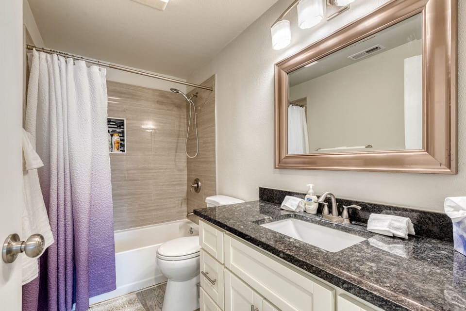 Full Bathroom in hallway with big vanity and countertop for extra space