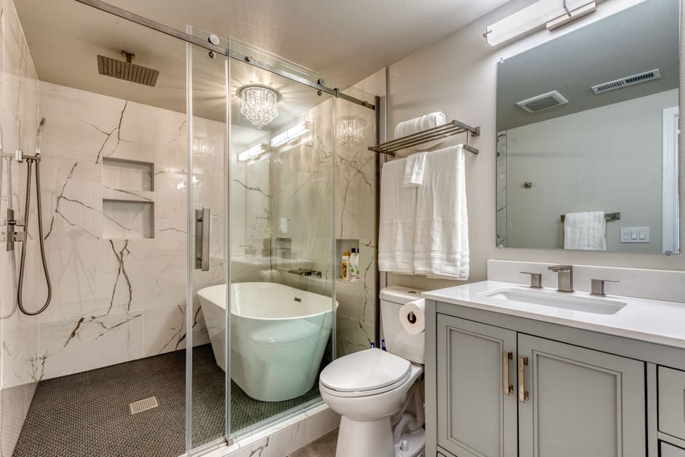 Spa like bathroom with high-end walk-in shower and bathtub to relax
