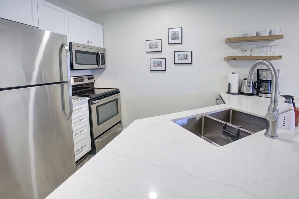 `Her place is super clean and well outfitted. Lots of amenities close by (groceries, pharmacy, liquor store etc). Absolutely as advertised. Would highly recommend this condo!`
