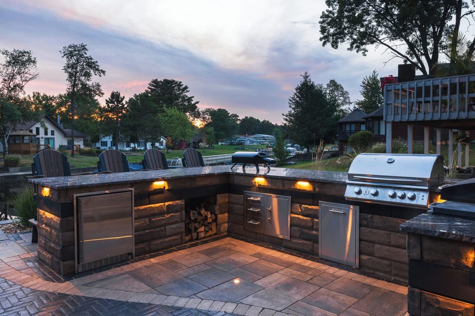 Fully equipped outdoor kitchen with breathtaking lake views, perfect for cooking up a meal while soaking in the scenery.