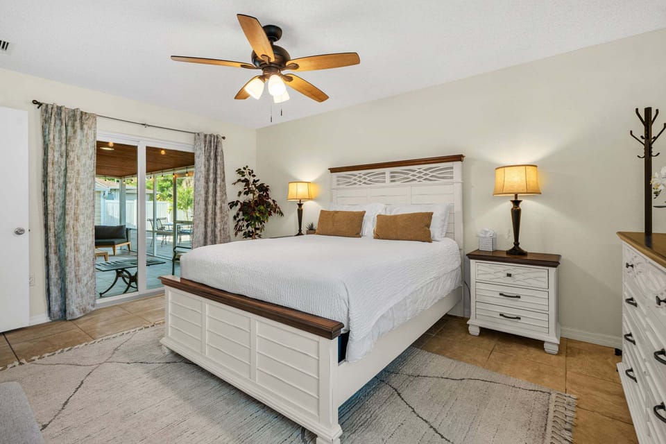 Bedroom 1: Queen Bed with sliding Glass door to covered porch.
