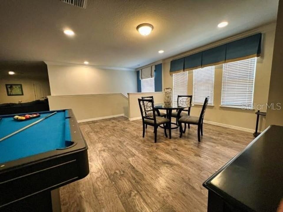 Second floor living area with pool table as well as Foosball 