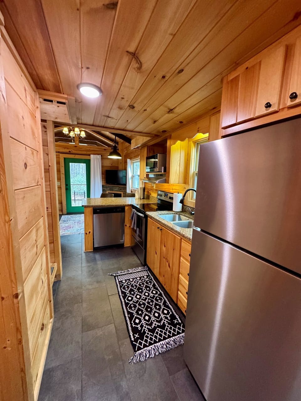Kitchen looking towards the front, screened-in porch