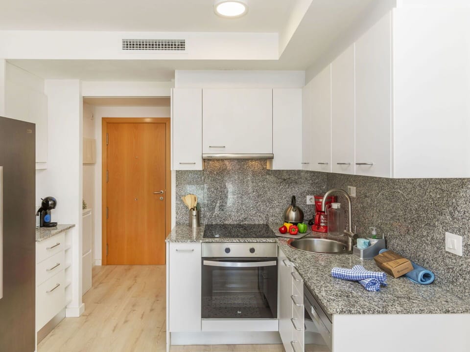 Kitchen, Countertop, Flooring, Interior Design, Kitchen Appliance, Major Appliance, Furniture, Wood, Floor, Cabinetry
