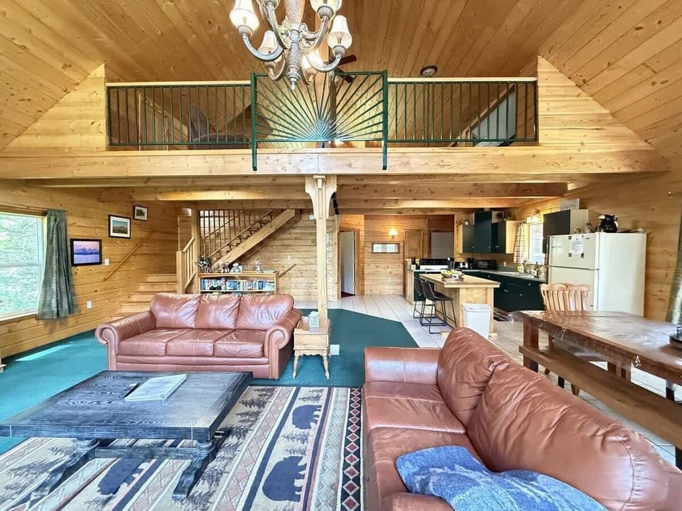 Spacious living room with fireplace for you to enjoy.