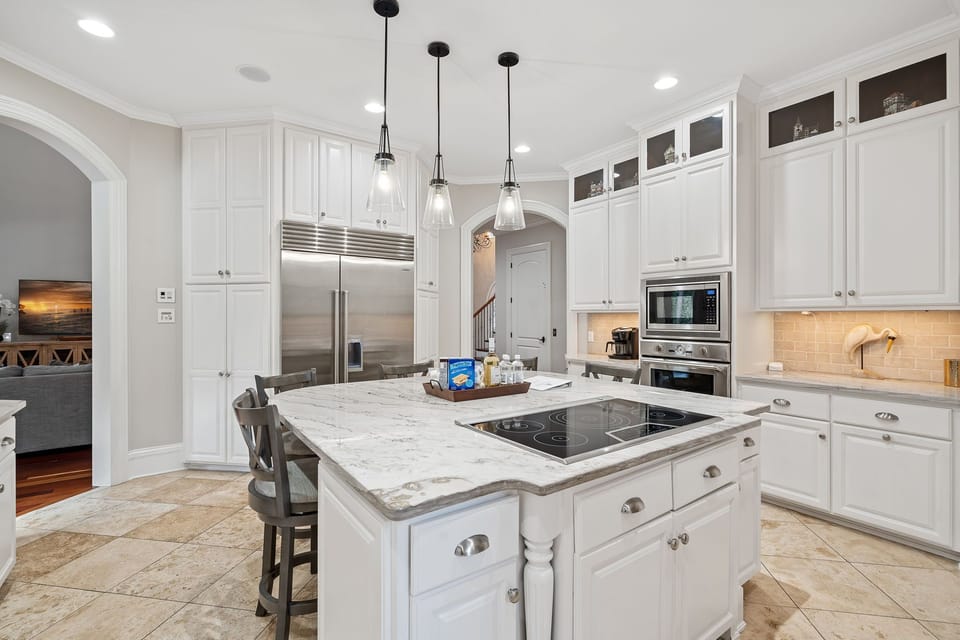 Updated kitchen with island seating and a pantry.