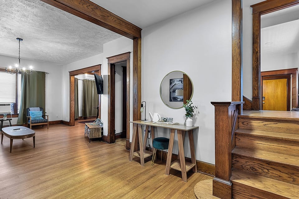 Your open-concept space features warm hardwood floors and rich wood trim, creating an inviting atmosphere for relaxing and working.