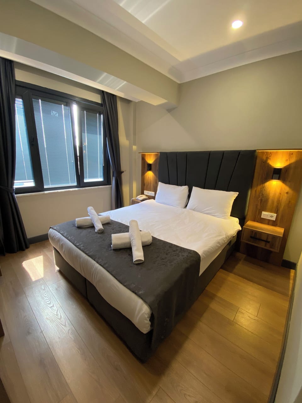 Premium bedding, desk, laptop workspace, soundproofing