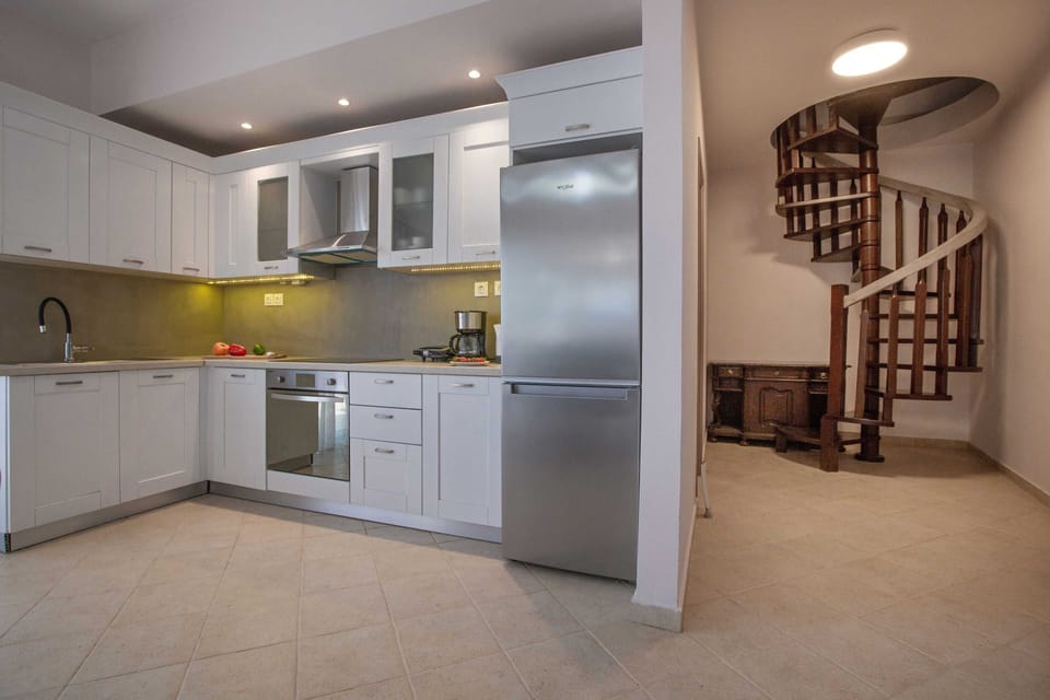 Comfort Apartment | Private kitchen | Full-size fridge, oven, stovetop, dishwasher