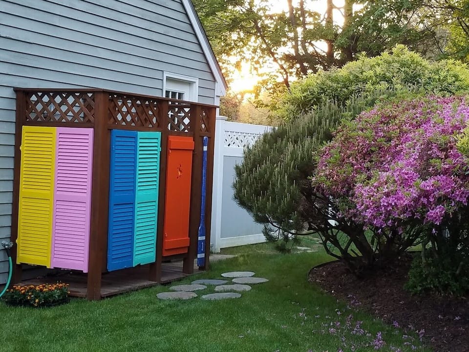 outside shower has hot and cold water