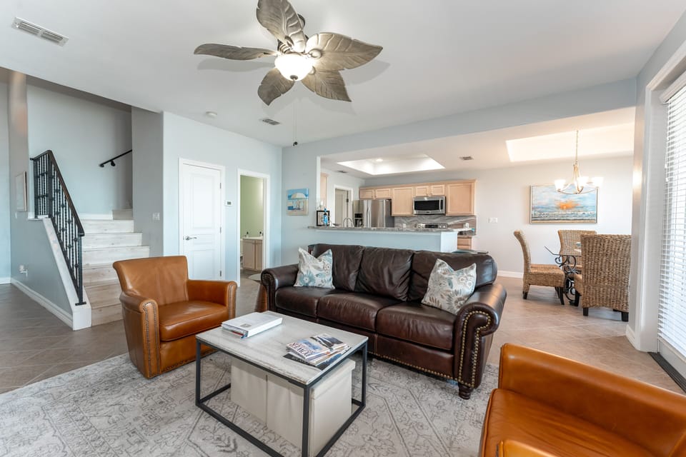 Living room looking into kitchen and dining area