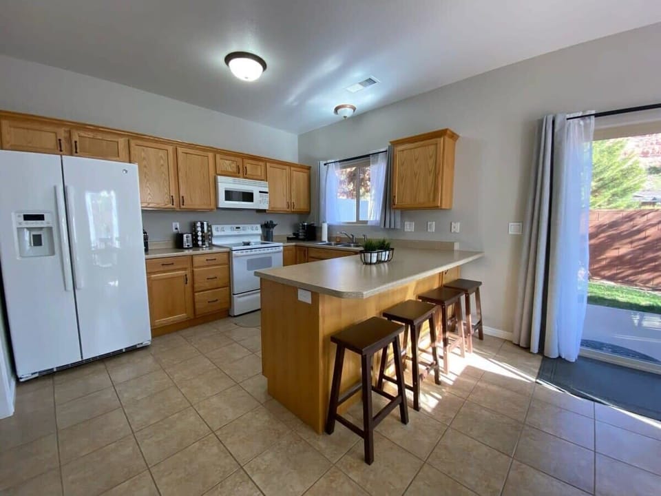 Gather around the open kitchen with friends and family and enjoy cooking a nice meal together.