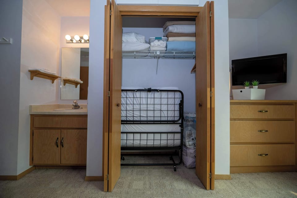 Interior of closet with rollaway bed