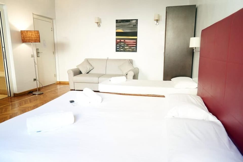 Deluxe Quadruple Room | Egyptian cotton sheets, Select Comfort beds, in-room safe, desk