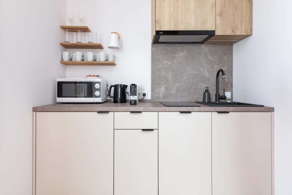 The fully equipped kitchenette includes everything you need for a home-cooked meal.
