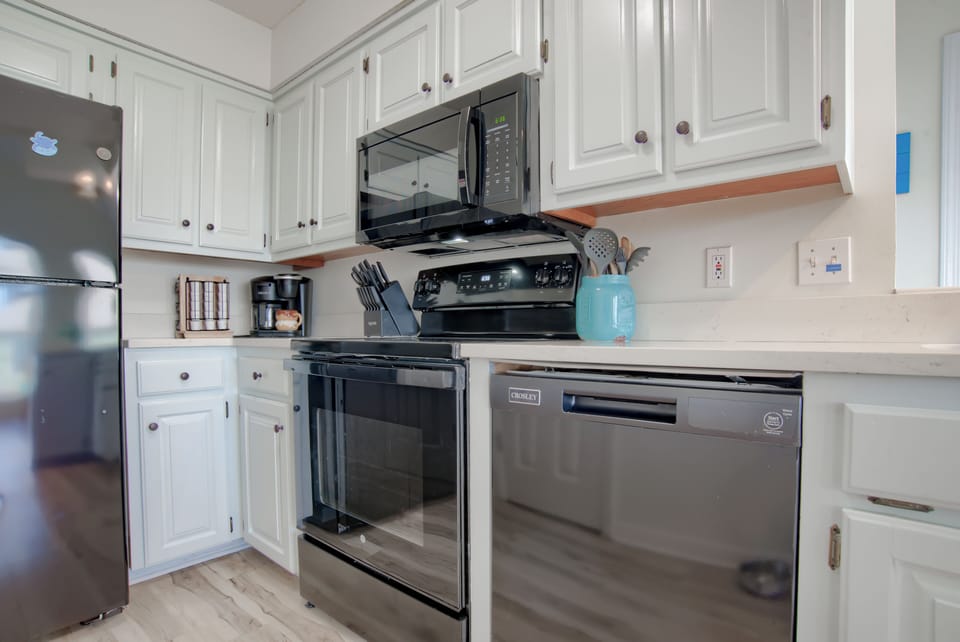 Kitchen with stainless steel appliances, and all the tools to make a great meal 