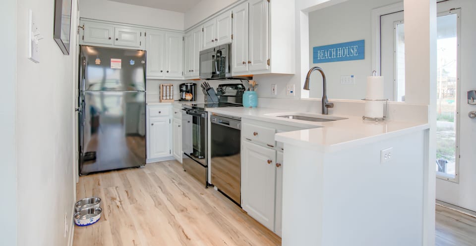 Kitchen with stainless steel appliances, and all the tools to make a great meal 