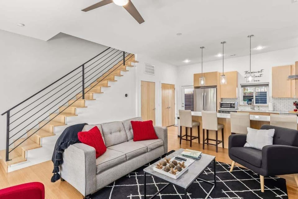 Cozy living room with smart TV, comfortable sofa and stylish décor—ideal for movie nights or catching the game.
