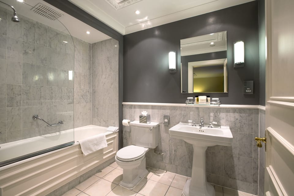 Combined shower/tub, designer toiletries, hair dryer, bathrobes