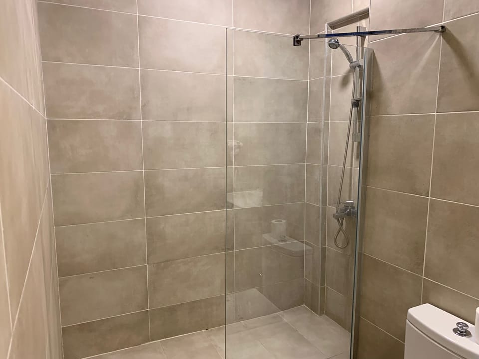 Family Room, Terrace, Pool View | Bathroom | Shower, hair dryer, slippers, towels