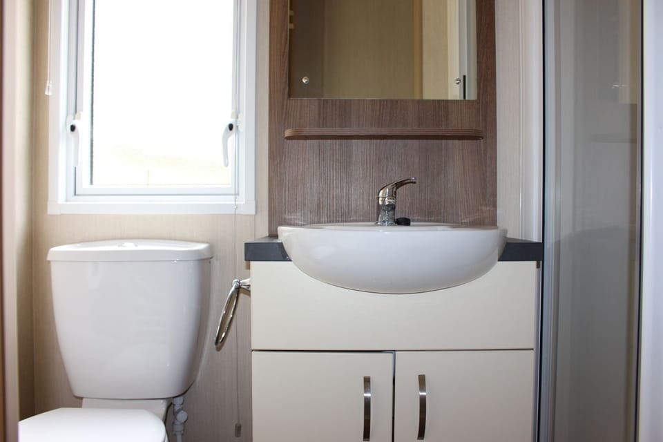 Bathroom with shower , basin and toilet